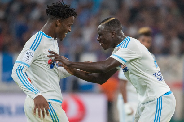 Marseille's Belgian forward Michy Batshuayi (L) is congratulated by Marseille's French defender Benjamin Mendy after scoring a goal during the French L1 football match Olympique de Marseille vs Troyes on August 23, 2015 at the Velodrome stadium in Marseille, southern France. AFP PHOTO / BERTRAND LANGLOIS (Photo credit should read BERTRAND LANGLOIS/AFP/Getty Images)