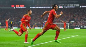 CARDIFF, WALES - JUNE 12: Wales player Gareth Bale celebrates after scoring the opening goal during the UEFA EURO Group B 2016 Qualifier between Wales and Belguim at Cardiff City stadium on June 12, 2015 in Cardiff, United Kingdom. (Photo by Stu Forster/Getty Images)
